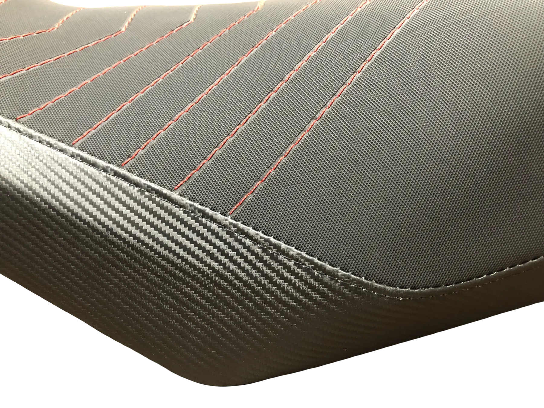 Close-up detail of custom motorcycle seat stitching and material transitions
